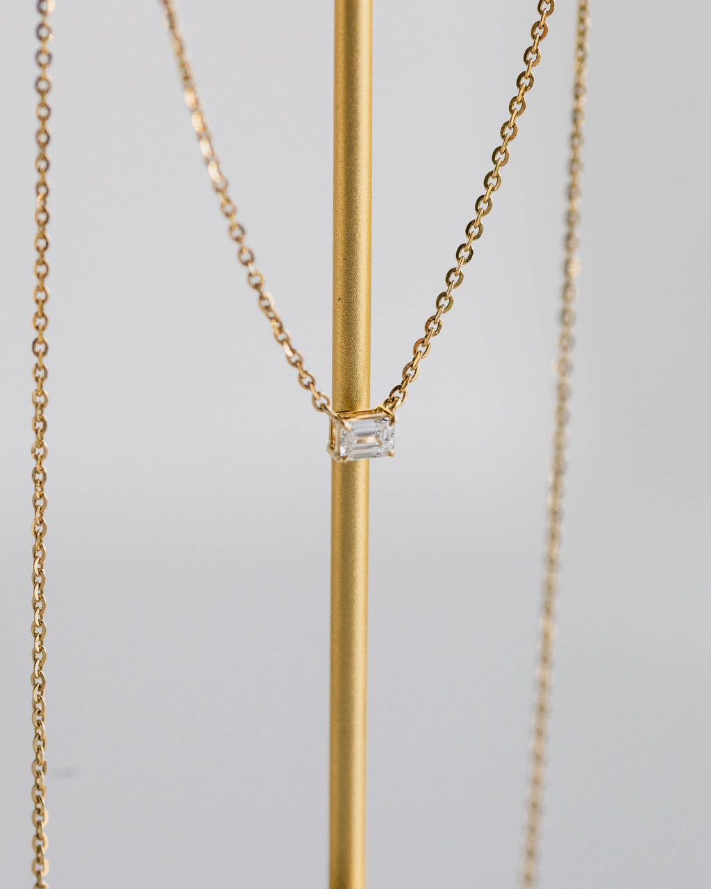 Emerald East-West Pendant — 0.24ctw Yellow Gold