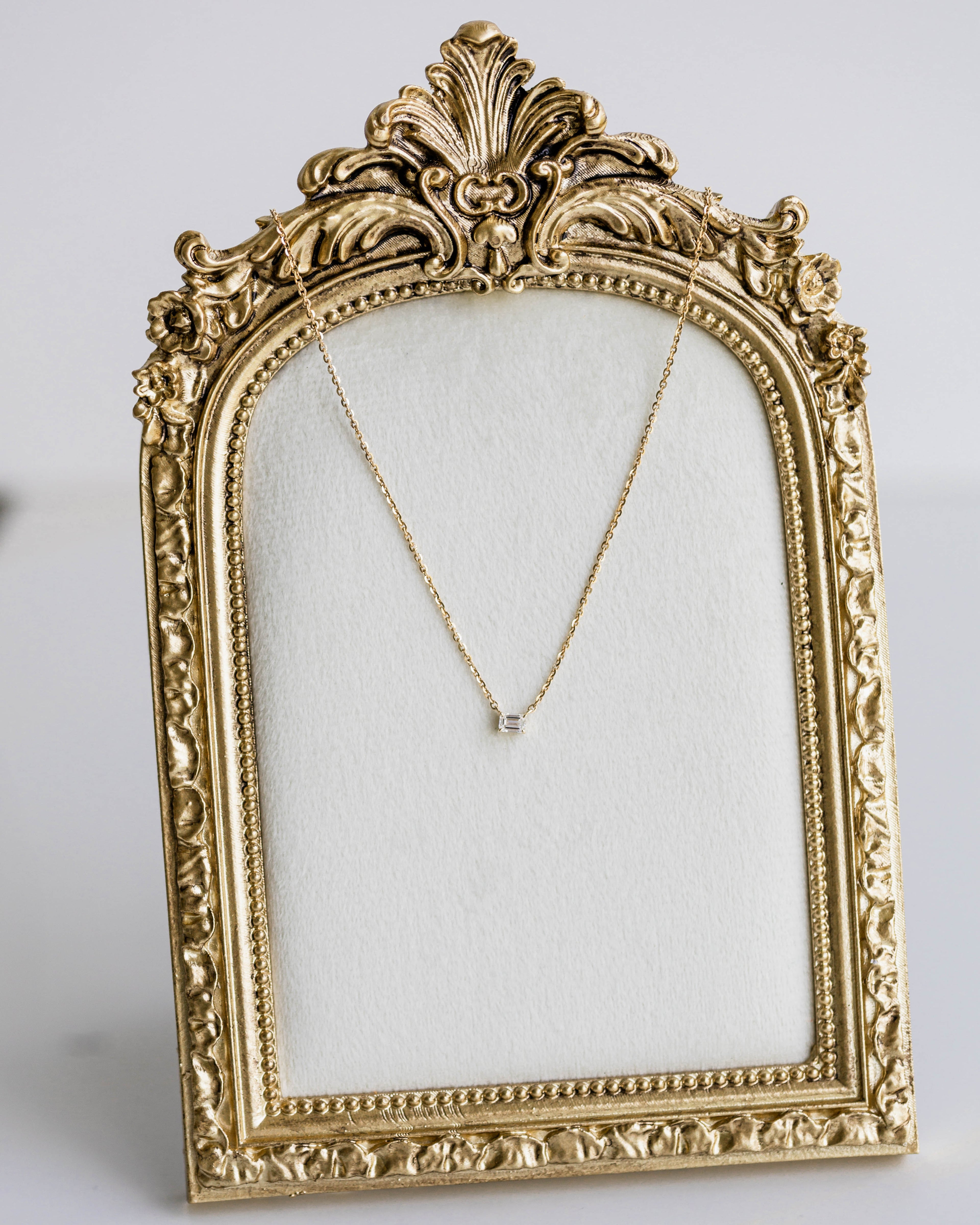 Emerald East-West Pendant — 0.24ctw Yellow Gold